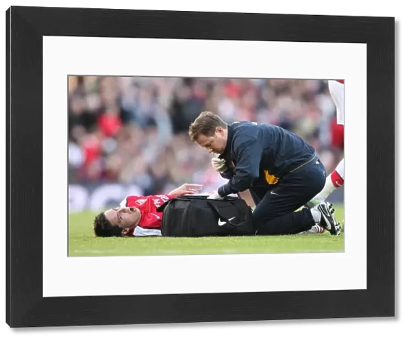 Arsenal physio Colin Lewin with injured Samir Nasri