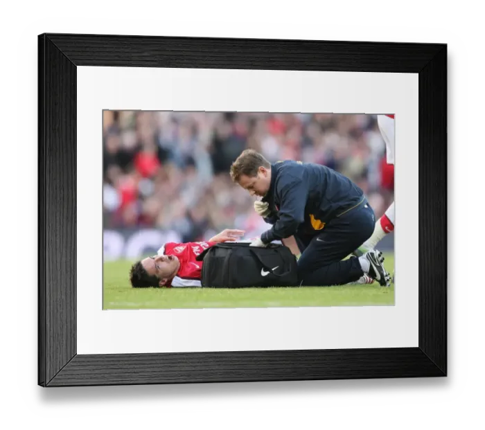 Framed Print : Arsenal physio Colin Lewin with injured Samir Nasri Framed Print : Arsenal physio Colin Lewin with injured Samir Nasri