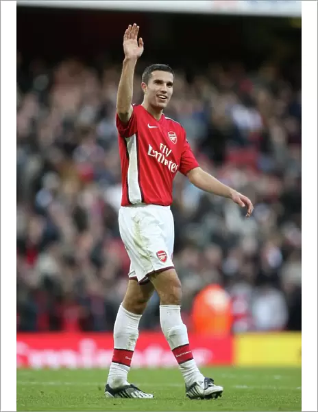 Robin van Persie (Arsenal) waves to his family after the match
