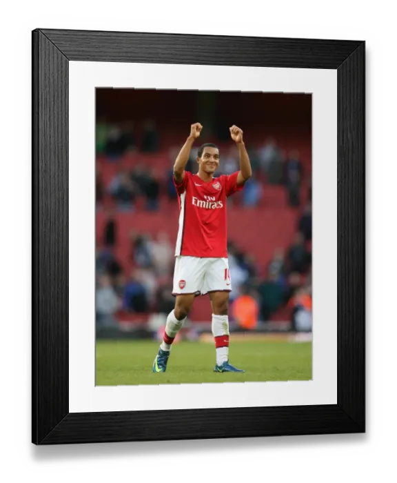 Framed Print : Arsenal goalscorer Theo Walcott celebrates after the match