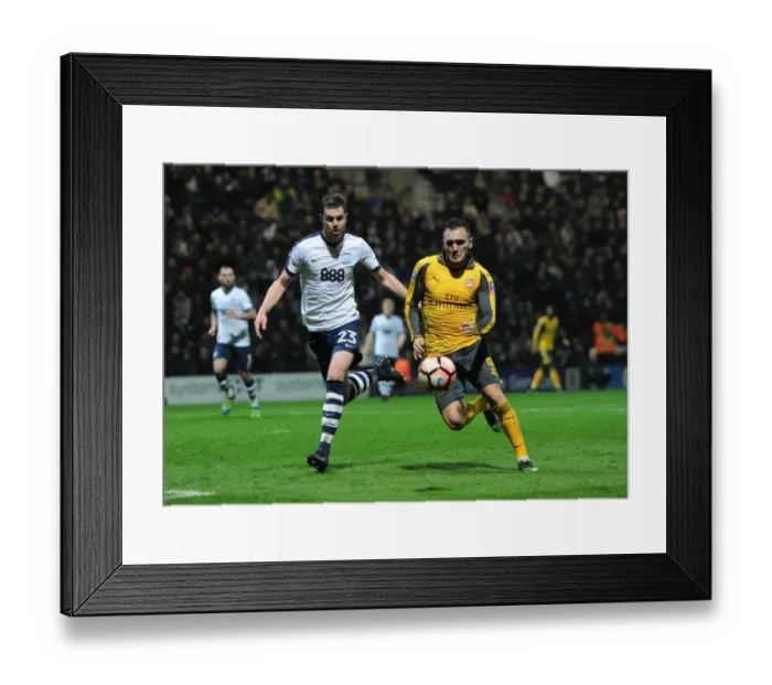 Framed Print : Preston North End vs Arsenal: Lucas Perez Faces Off Against Paul Huntington in FA Cup Clash