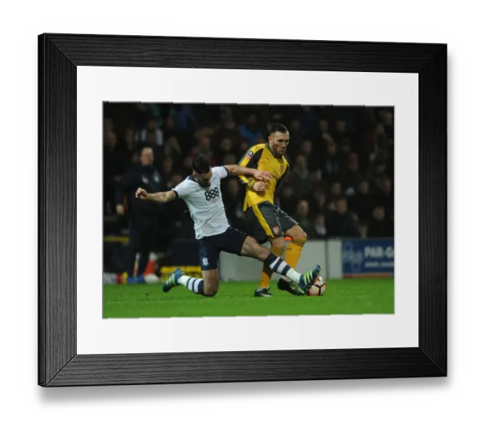 Framed Print : Intense Face-Off: Perez vs Cunningham in FA Cup Battle between Preston and Arsenal