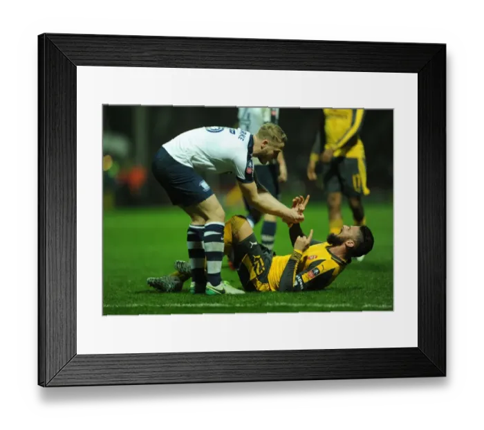 Framed Print : Giroud vs Clarke: Tangled Battle - Arsenal's FA Cup Clash at Preston North End Framed Print : Giroud vs Clarke: Tangled Battle - Arsenal's FA Cup Clash at Preston North End