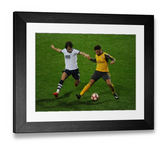 Framed Print : Arsenal vs Preston North End: FA Cup Third Round Clash - Oxlade-Chamberlain vs Pearson