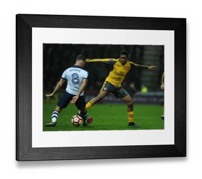 Framed Print : Arsenal's Alex Iwobi Faces Off Against Preston's Alan Browne in FA Cup Clash Framed Print : Arsenal's Alex Iwobi Faces Off Against Preston's Alan Browne in FA Cup Clash