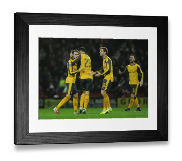 Framed Print : Aaron Ramsey celebrates scoring a goal for Arsenal. Preston North End 1: 2 Arsenal