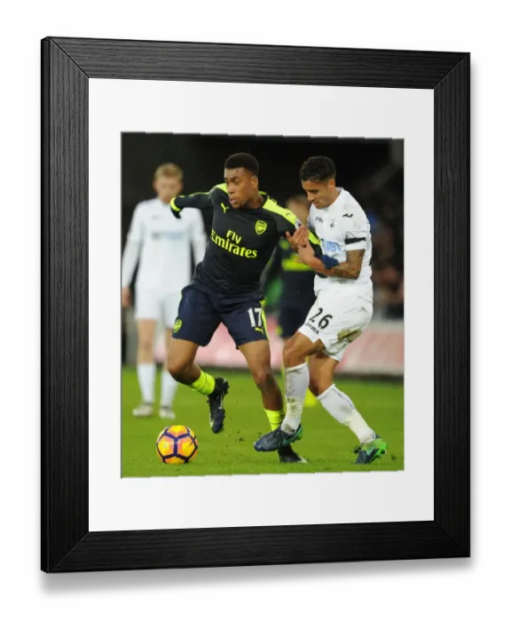 Framed Print : Intense Face-Off: Alex Iwobi vs Kyle Naughton - Swansea vs Arsenal Premier League Clash