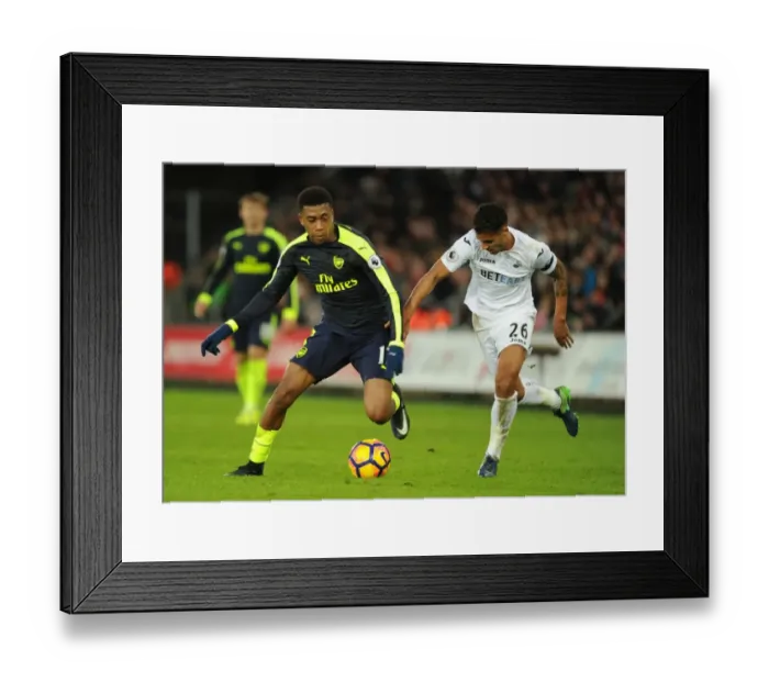 Framed Print : Intense Face-Off: Iwobi vs Naughton in Swansea-Arsenal Premier League Clash Framed Print : Intense Face-Off: Iwobi vs Naughton in Swansea-Arsenal Premier League Clash