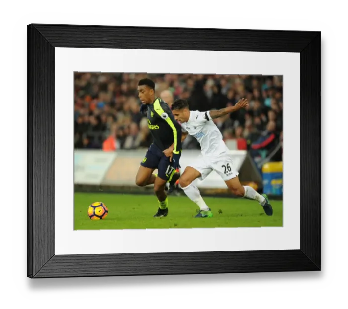 Framed Print : Intense Face-off: Alex Iwobi vs Kyle Naughton in Swansea vs Arsenal Premier League Clash Framed Print : Intense Face-off: Alex Iwobi vs Kyle Naughton in Swansea vs Arsenal Premier League Clash