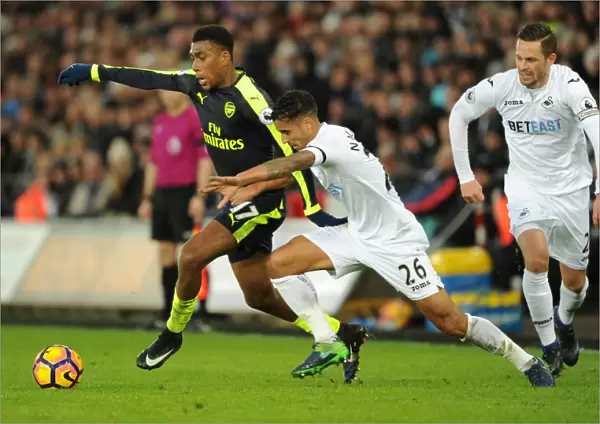 Arsenal's Alex Iwobi Faces Off Against Swansea's Kyle Naughton in Premier League Clash