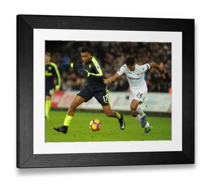 Framed Print : Intense Face-Off: Alex Iwobi vs Kyle Naughton - Swansea vs Arsenal Premier League Clash