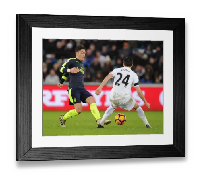 Framed Print : Mesut Ozil vs Jack Cork: A Premier League Showdown at Swansea City Framed Print : Mesut Ozil vs Jack Cork: A Premier League Showdown at Swansea City
