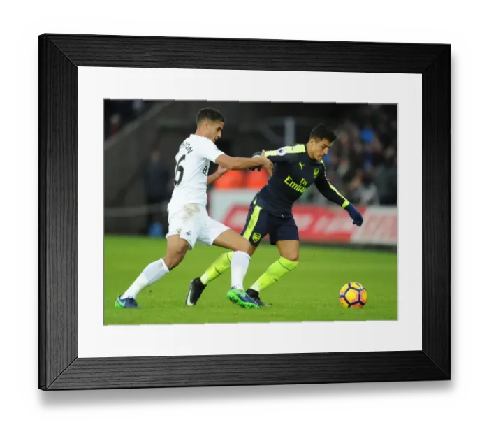 Framed Print : Arsenal's Alexis Sanchez Faces Off Against Swansea's Kyle Naughton in Premier League Clash Framed Print : Arsenal's Alexis Sanchez Faces Off Against Swansea's Kyle Naughton in Premier League Clash