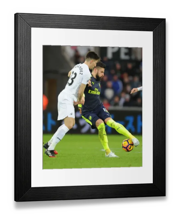 Framed Print : Giroud vs Fernandez: Intense Battle at Swansea's Liberty Stadium - Arsenal vs Swansea City, Premier League 2016-17