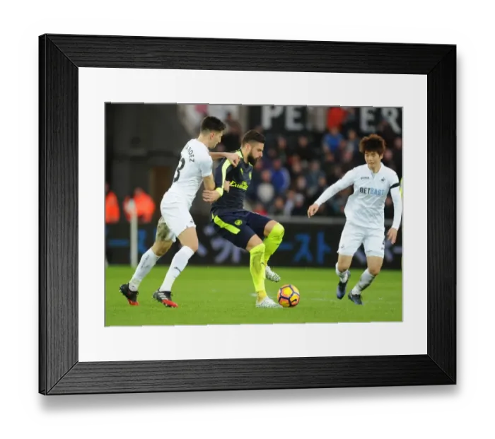 Framed Print : Giroud vs Fernandez: A Fierce Rivalry Erupts in the Arsenal vs Swansea City Premier League Clash, 2016-17