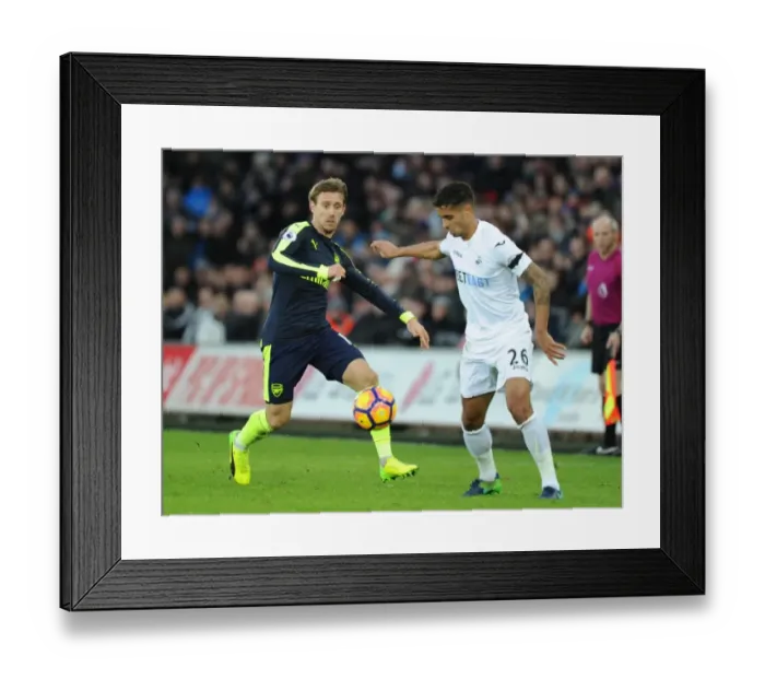 Framed Print : Nacho Monreal vs. Kyle Naughton: Intense Battle in Swansea City vs. Arsenal Premier League Clash