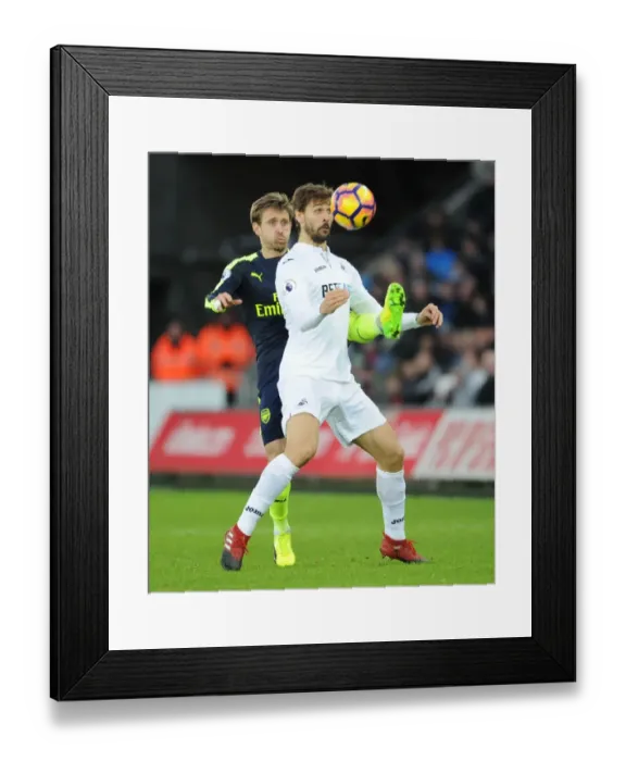Framed Print : Nacho Monreal vs Fernando Llorente: Intense Clash Between Swansea and Arsenal (Premier League, 2016-17) Framed Print : Nacho Monreal vs Fernando Llorente: Intense Clash Between Swansea and Arsenal (Premier League, 2016-17)