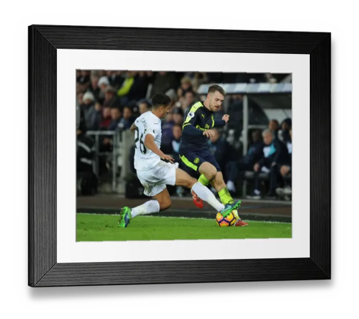 Framed Print : Ramsey vs Naughton: Intense Battle in Swansea City vs Arsenal Premier League Clash