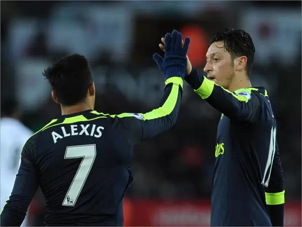 Alexis Sanchez celebrates scoring Arsenals 4th goal with Mesut Ozil. Swansea City 0
