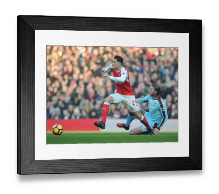 Framed Print : Arsenal vs Burnley: Xhaka vs Hendrick - Intense Battle in the Premier League