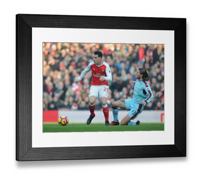 Framed Print : Xhaka vs Hendrick: A Premier League Battle at Emirates Stadium