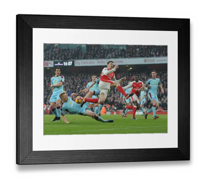 Framed Print : Arsenal vs Burnley: Laurent Koscielny Fouls Ben Mee in Intense Premier League Clash