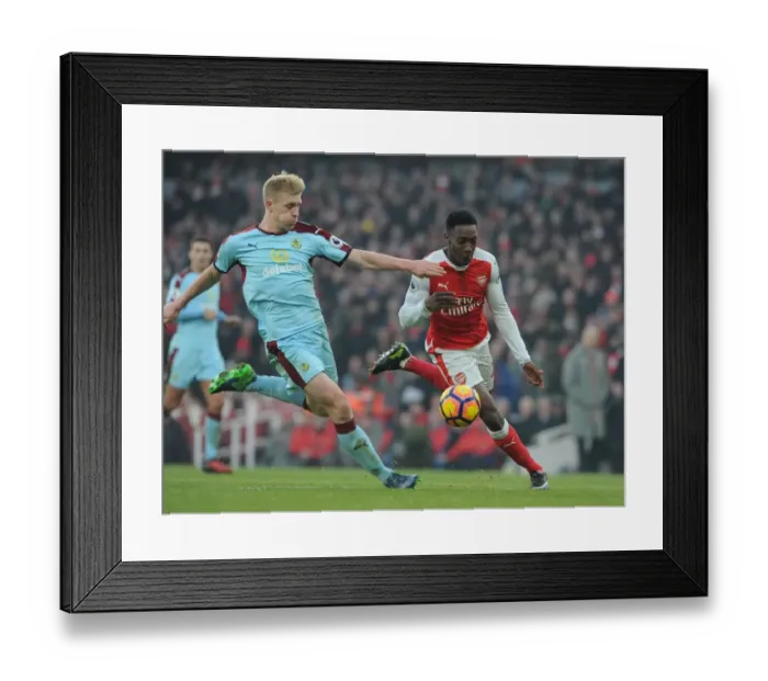 Framed Print : Arsenal vs Burnley: Intense Battle between Welbeck and Mee in the Premier League
