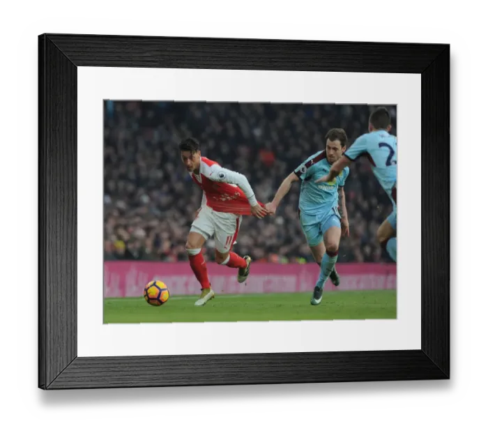 Framed Print : Arsenal vs Burnley: Ozil Held Back by Barnes in Intense Premier League Clash (2016-17)