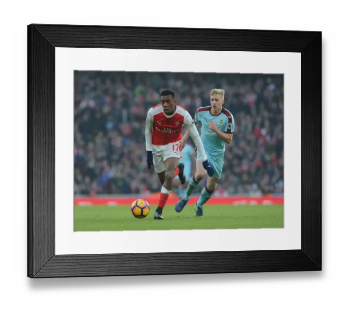 Framed Print : Arsenal's Alex Iwobi Clashes with Burnley's Ben Mee in Premier League Showdown Framed Print : Arsenal's Alex Iwobi Clashes with Burnley's Ben Mee in Premier League Showdown