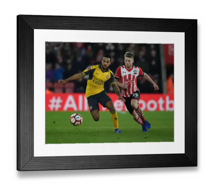 Framed Print : Theo Walcott Breaks Past Southampton's Josh Sims in FA Cup Fourth Round Clash Framed Print : Theo Walcott Breaks Past Southampton's Josh Sims in FA Cup Fourth Round Clash