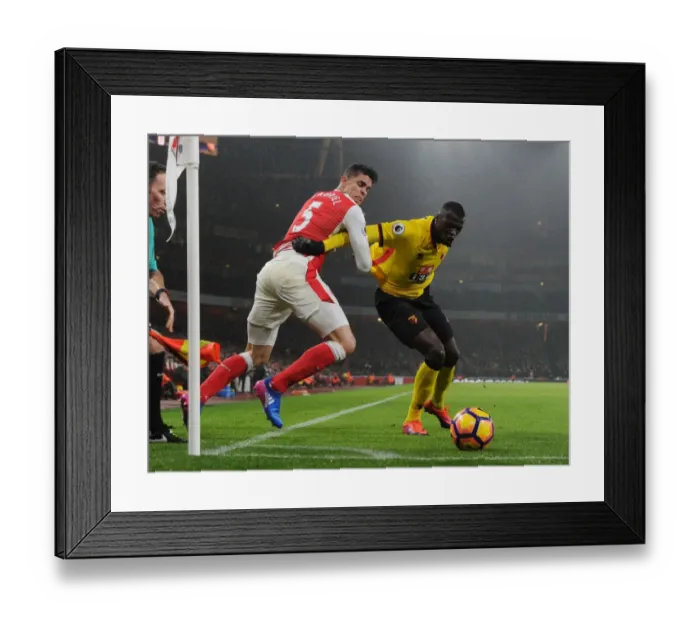 Framed Print : Arsenal vs. Watford: Gabriel vs. Niang - Premier League Clash at Emirates Stadium Framed Print : Arsenal vs. Watford: Gabriel vs. Niang - Premier League Clash at Emirates Stadium