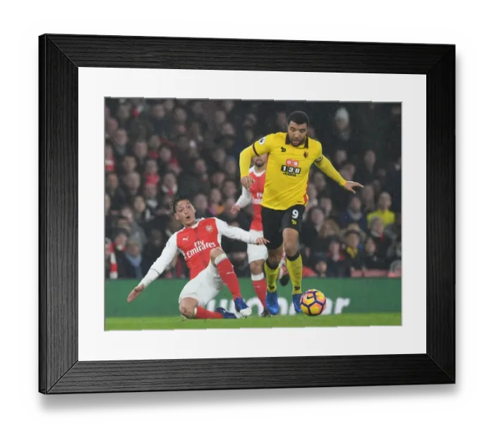 Framed Print : Arsenal vs. Watford: Clash Between Ozil and Deeney in the Premier League Framed Print : Arsenal vs. Watford: Clash Between Ozil and Deeney in the Premier League