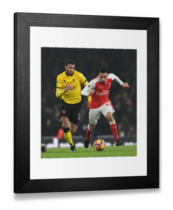 Framed Print : Arsenal's Coquelin Outmaneuvers Watford's Capoue in Premier League Clash