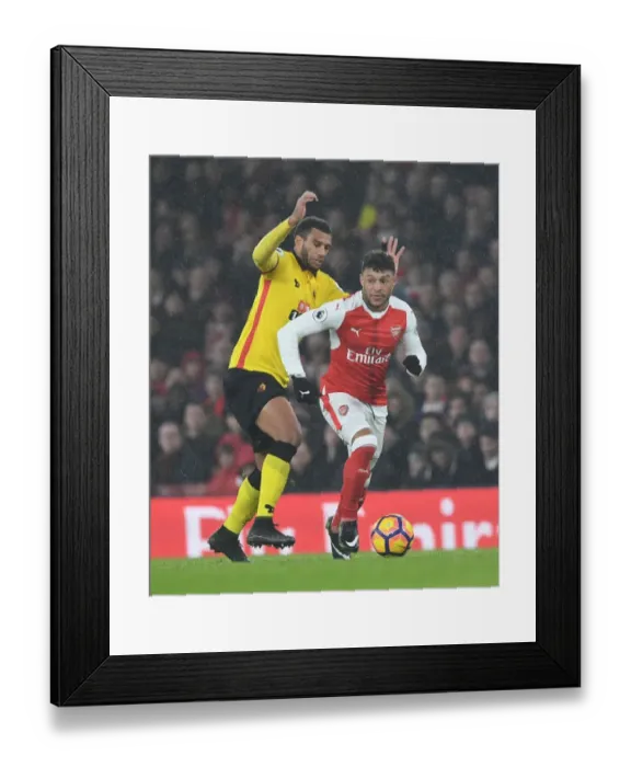 Framed Print : Arsenal's Oxlade-Chamberlain Outmaneuvers Watford's Capoue in Premier League Clash Framed Print : Arsenal's Oxlade-Chamberlain Outmaneuvers Watford's Capoue in Premier League Clash