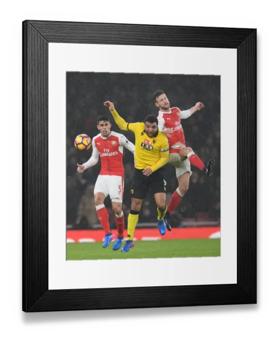Framed Print : Arsenal vs. Watford: Gabriel and Mustafi Clash in Intense Premier League Match