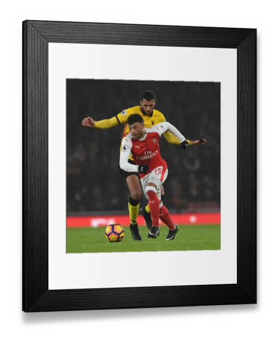 Framed Print : Oxlade-Chamberlain vs. Capoue: A Midfield Battle at the Emirates Stadium, Premier League 2016-17
