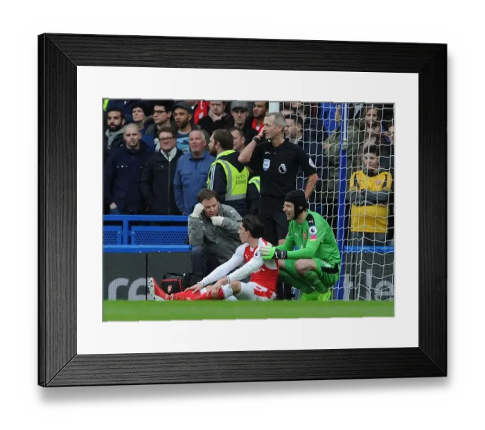 Framed Print : Arsenal: Hector Bellerin Receives Medical Assistance from Petr Cech and Colin Lewin during Chelsea Match Framed Print : Arsenal: Hector Bellerin Receives Medical Assistance from Petr Cech and Colin Lewin during Chelsea Match
