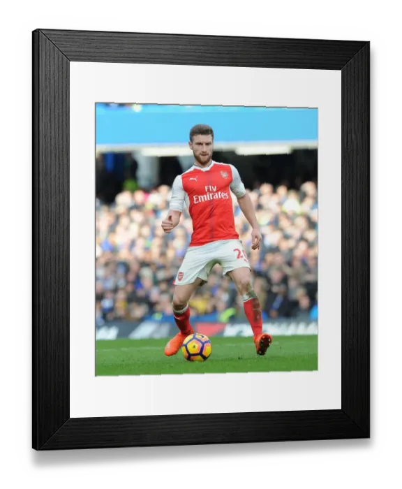 Framed Print : Shkodran Mustafi: Unyielding Determination in the Heat of the Chelsea vs Arsenal Rivalry, Premier League 2016-17