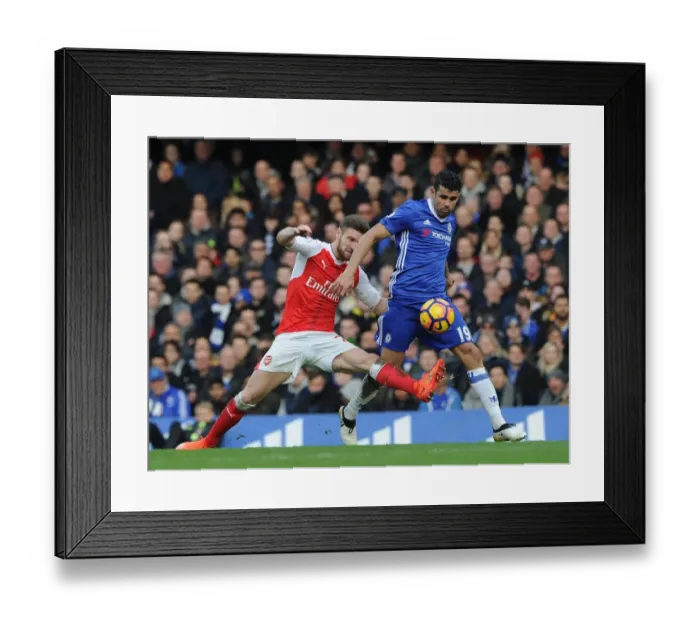 Framed Print : Mustafi vs Costa: A Footballing Battle in the Premier League Clash between Chelsea and Arsenal (2016-17)