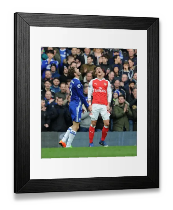 Framed Print : Frustration and Rivalry: Ozil vs. Alonso in the Chelsea vs. Arsenal Premier League Clash Framed Print : Frustration and Rivalry: Ozil vs. Alonso in the Chelsea vs. Arsenal Premier League Clash