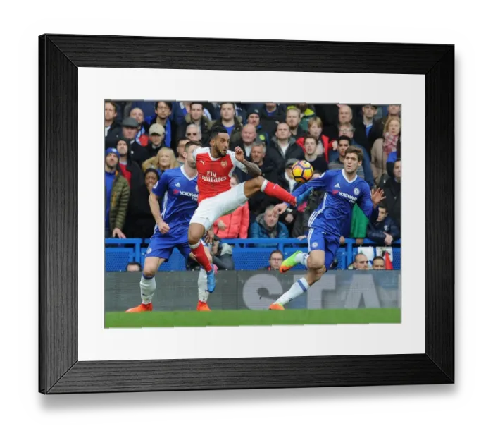 Framed Print : Theo Walcott vs Marcos Alonso: Intense Battle at Stamford Bridge - Premier League 2016-17