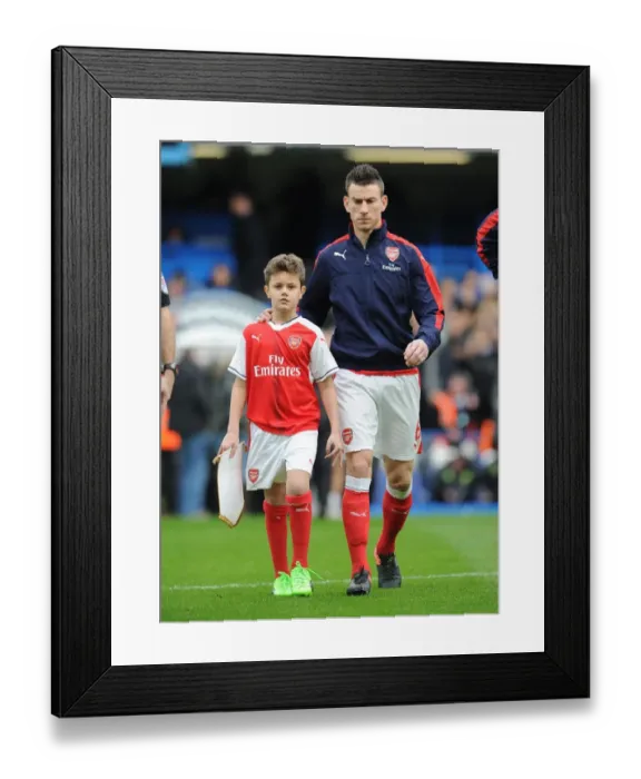 Framed Print : Arsenal mascot with Laurent Koscielny (Arsenal). Chelsea 3: 1 Arsenal. Premier League Framed Print : Arsenal mascot with Laurent Koscielny (Arsenal). Chelsea 3: 1 Arsenal. Premier League