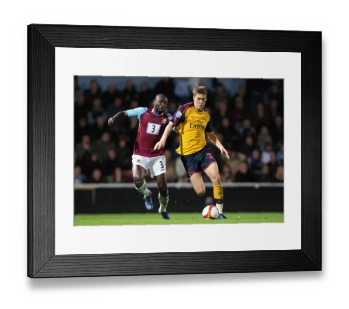 Framed Print : Nicklas Bendtner (Arsenal) Herita Ilunga (West Ham) Framed Print : Nicklas Bendtner (Arsenal) Herita Ilunga (West Ham)