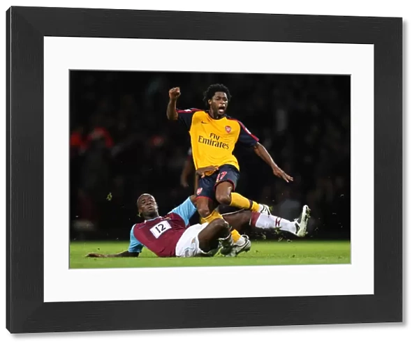 Alex Song (Arsenal) is fouled by Carlton Cole (West Ham)