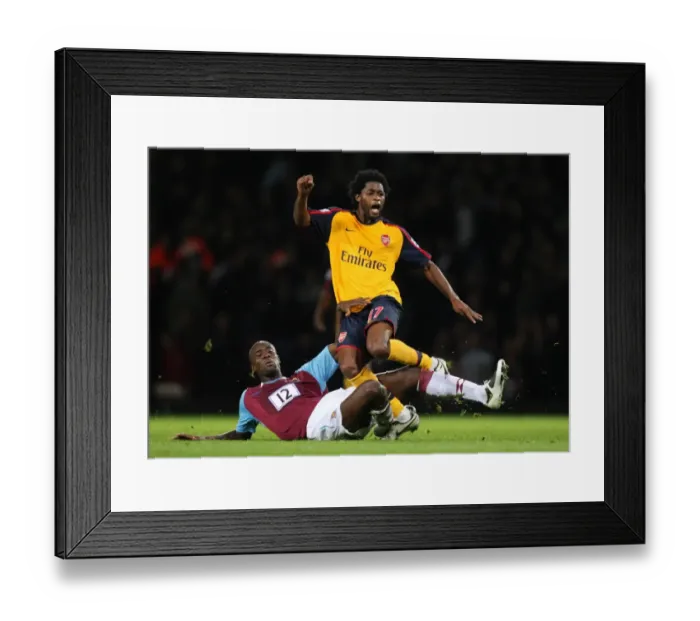 Framed Print : Alex Song (Arsenal) is fouled by Carlton Cole (West Ham) Framed Print : Alex Song (Arsenal) is fouled by Carlton Cole (West Ham)