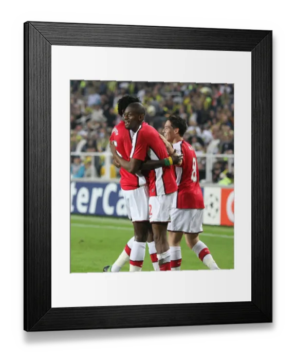 Framed Print : Triumphant Threesome: Diaby, Adebayor, Nasri Celebrate Arsenal's 3rd Goal in 2:5 Victory over Fenerbahce (UEFA Champions League, Group G)
