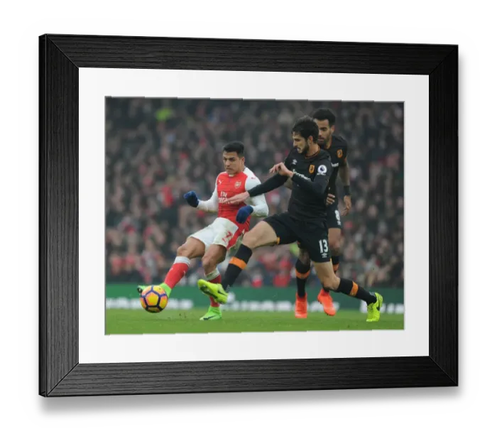 Framed Print : Arsenal's Alexis Sanchez vs. Hull City's Andrea Ranocchia: A Premier League Showdown at Emirates Stadium