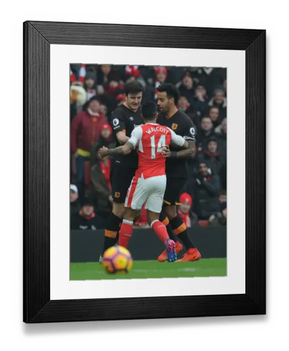 Framed Print : Arsenal vs Hull City: Walcott's Tense Encounter with Maguire and Huddlestone