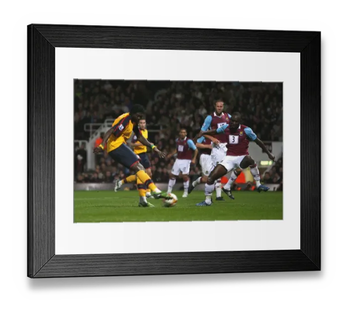 Framed Print : Emmanuel Adebayors shot hits West Hams Julien Flaubert Framed Print : Emmanuel Adebayors shot hits West Hams Julien Flaubert