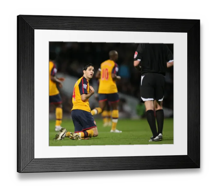 Framed Print : Cesc Fabregas is booked by referee Phil Dowd Framed Print : Cesc Fabregas is booked by referee Phil Dowd